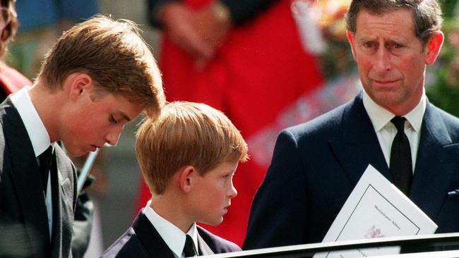 Prince Charles and sons Harry and William wait in front of Westminster Abbey in London after the Princess of Wales’ funeral. Picture: Joel Robine/Pool/AFP