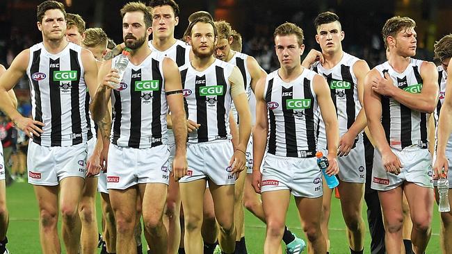 Collingwood players leave the ground following another loss. Picture: Getty Images