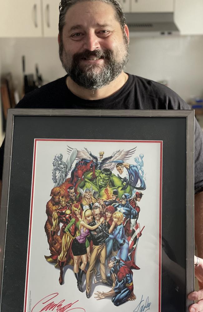 Perna with his poster signed by Stan Lee.