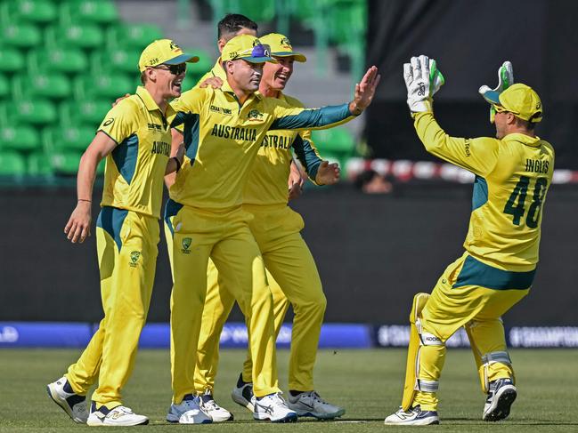 Australia's players celebrate after the dismissal of England's Jamie Smith during the ICC Champions Trophy clash on Saturday night. Picture: AFP