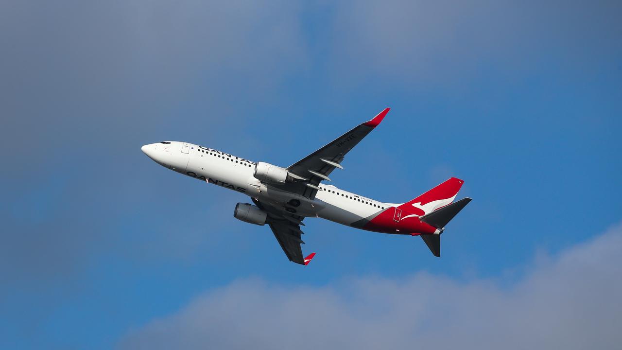 Qantas staff are not allowed to wear pins and badges unless they are part of the approved uniform. Picture: NCA NewsWire / Gaye Gerard