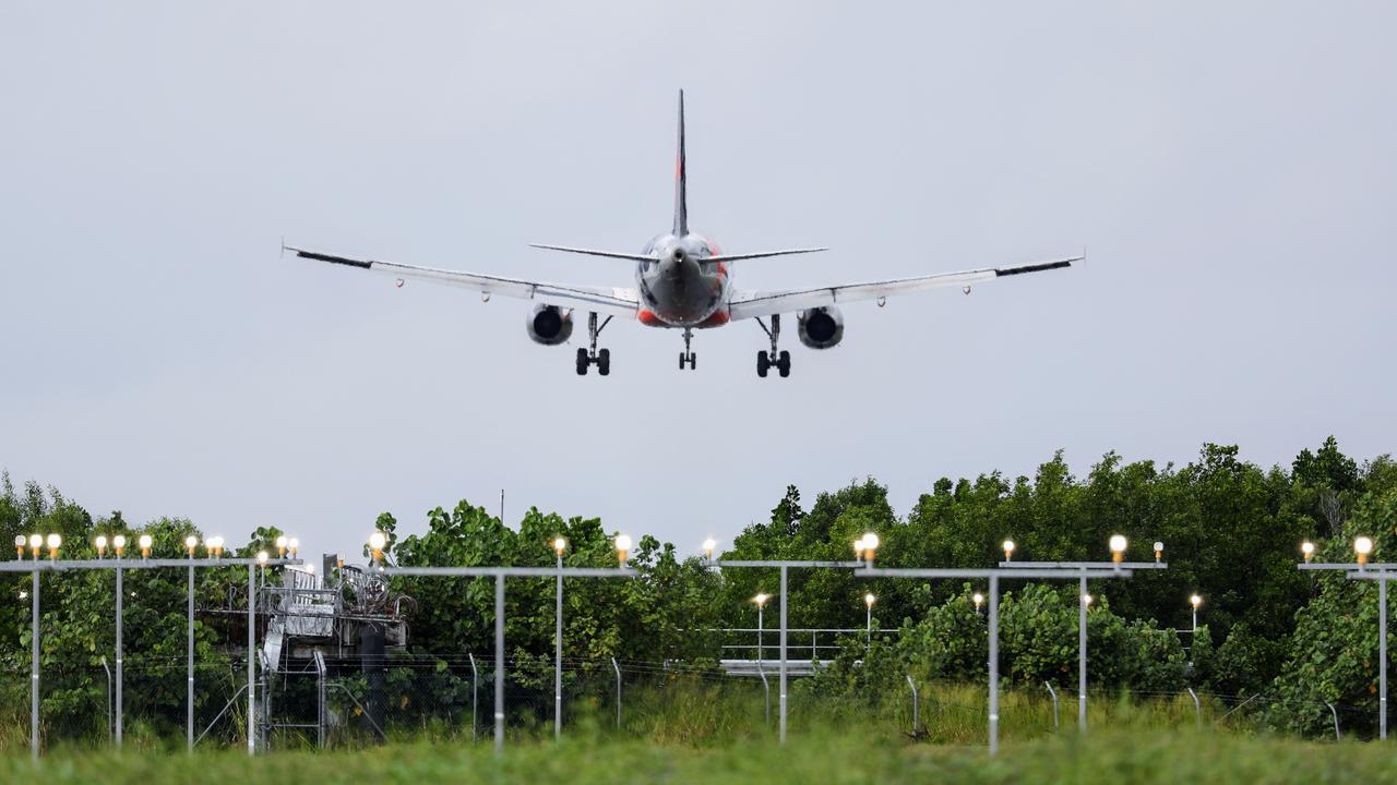 A Jetstar commercial passenger plane comes in to land at the Cairns Airport, using an Instrument Landing System (ILS) to guide the aircraft approach angle need to land safely. Picture: Brendan Radke.