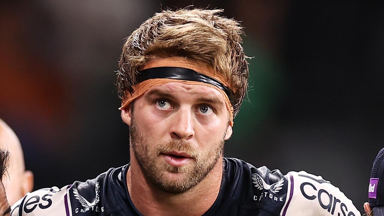 SYDNEY, AUSTRALIA - MARCH 12: Christian Welch of the Storm is helped from the field during the round one NRL match between the Wests Tigers and the Melbourne Storm at CommBank Stadium, on March 12, 2022, in Sydney, Australia. (Photo by Mark Kolbe/Getty Images)