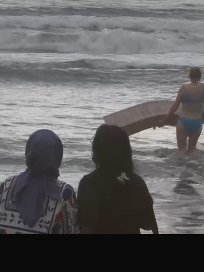 The man’s wife in the ocean. Picture: News Corp exclusive