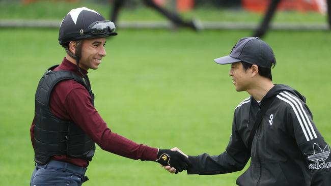 The Daily Telegraph 30.10.2024 Jockey Joao Moreira greets Corazon Beat trainer Shizuya Kato, pictured. Canterbury trackwork with the four internationals here for the Golden Eagle - Ascoli Piceno, Corazon Beat, Lake Forest and Lazzat. Picture: Rohan Kelly.