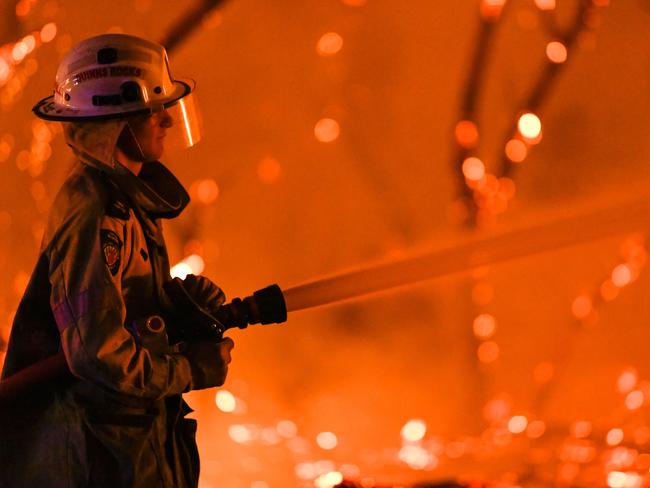 FILE - A supplied image obtained on Friday, December 13, 2019, of a bushfire in Yanchep, Western Australia, Wednesday, December 11, 2019. An emergency warning is in place for people in Two Rocks, Breakwater and Seatree Estates, as well as the northern parts of Yanchep (AAP Image/Supplied, DFES Incident Photographer Morten Boe) NO ARCHIVING, EDITORIAL USE ONLY