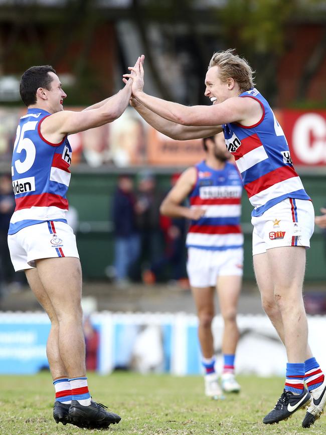 Central District’s Luke Barmby celebrates one of his three goals with teammate Luke Habel against Norwood. Picture: Sarah Reed