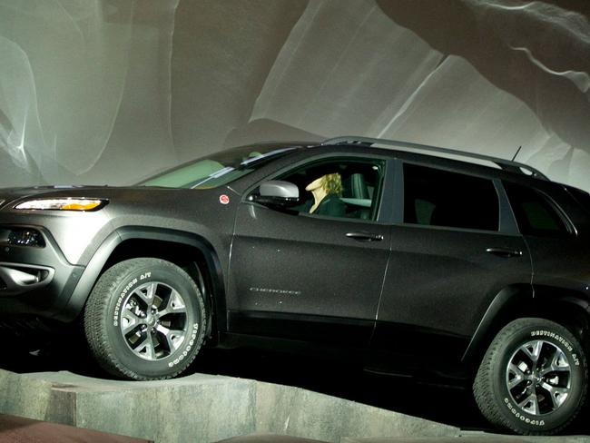 (FILES) In this file photo s new Jeep Cherokee makes its way over obstacles during a media conference at the New York International Auto show March 27, 2013 in New York. - On February 22 the Cherokee Nation said it has asked for its tribal name to be removed as a nameplate from Jeep sport utility vehicles and called for a dialogue with the automaker on "cultural appropriateness." The Native American group's principal chief Chuck Hoskin Jr asked Jeep's parent firm Stellantis "he does not condone" the use of the name Cherokee on the vehicles, according to a statement. (Photo by Don EMMERT / AFP)