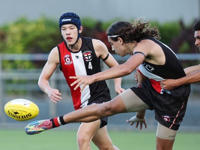 Saints' Harley Bell makes a difficult kick in the AFL Cairns Under 17B grand final match between the Cairns Saints and the South Cairns Cutters, held at Cazalys Stadium, Westcourt. Picture: Brendan Radke