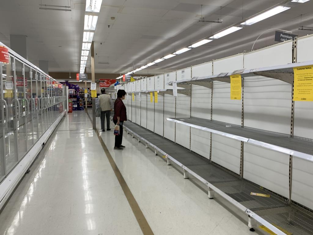 Shoppers have become accustomed to shelves stripped off essential items, as people stockpile supplies in case of a lockdown. Picture: John Grainger