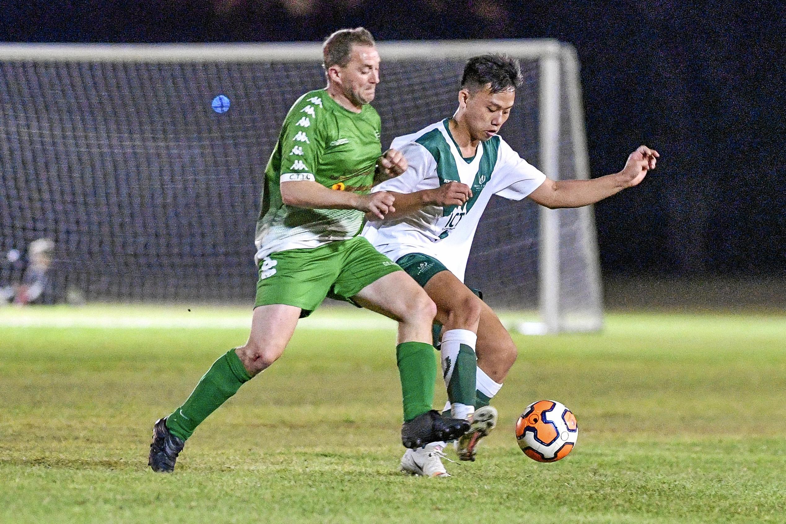 Clinton FC vs frenchville in the Central Queensland Premier League, division one. PICTURED: Clinton's Michael Stephen and Frenchville's Tinh Nguyen. Picture: Matt Taylor GLA030819SOCC