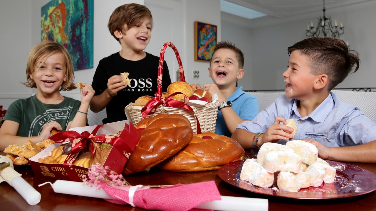 Christopher, Andreas, Dimitri and Andre enjoying some Greek Orthodox Easter sweets. Picture: Jonathan Ng