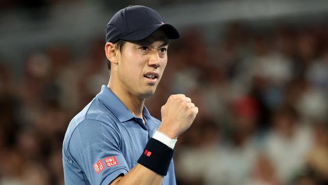 MELBOURNE, AUSTRALIA - JANUARY 12: Kei Nishikori of Japan celebrates a point against Thiago Monteiro of Brazil in the Men's Singles First Round during day one of the 2025 Australian Open at Melbourne Park on January 12, 2025 in Melbourne, Australia. (Photo by Kelly Defina/Getty Images)