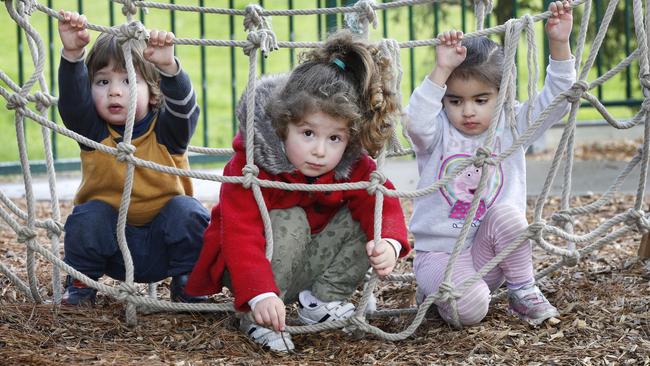 Deniz, 2 and Melis, 3, play with Ariana, 3 at Minifie Park Early Childhood Centre in Balwyn. Picture: David Caird