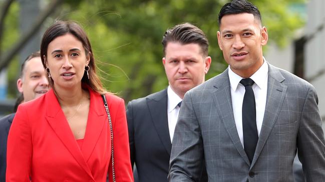 Israel Folau arrives at Melbourne’s Federal Court with his wife Maria and his legal team. Picture: David Geraghty