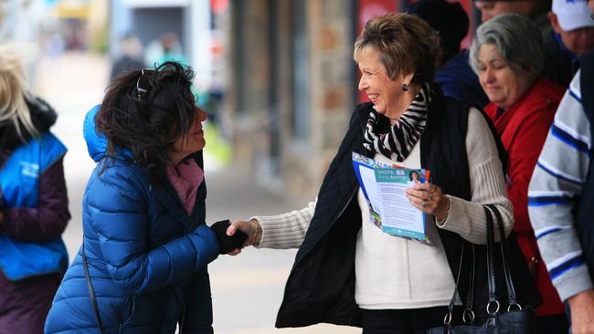 Mission accomplished: Julia Banks woos the pre-poll voter with a handshake at Rosebud in the federal seat of Flinders. Picture: Aaron Francis