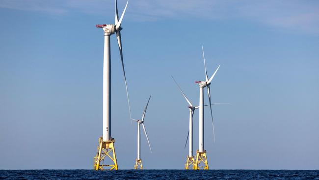 (FILES) Wind turbines generate electricity at the Block Island Wind Farm on July 7, 2022 near Block Island, Rhode Island. They're âuglyâ, âruin the landscapeâ and âkill whalesâ: Donald Trump accuses wind turbines of all sorts of evils and plunged their industry into turmoil as soon as he returned to the White House. âWe're not going to do the windmill thing,â the American president launched on January 20, the day of his inauguration, before digressing on the subject. âThey kill birds and ruin beautiful landscapesâ, âthey're all made in Chinaâ and âif you like whales, you don't want wind turbines eitherâ, said the Republican, before signing a series of executive orders at the end of the day to put a spanner in the industry's works. (Photo by JOHN MOORE / GETTY IMAGES NORTH AMERICA / AFP)