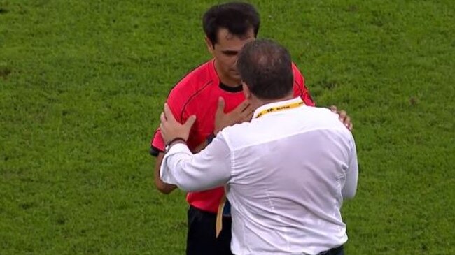 Ange Postecoglou has words with the referee.