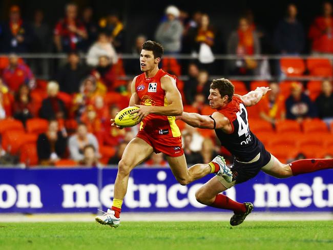 Action from the Australian Football League match between the Gold Coast Suns and the Melbourne Demons, held at Metricon Stadium, Carrara, Gold Coast. Photo of Jaeger O'Meara.