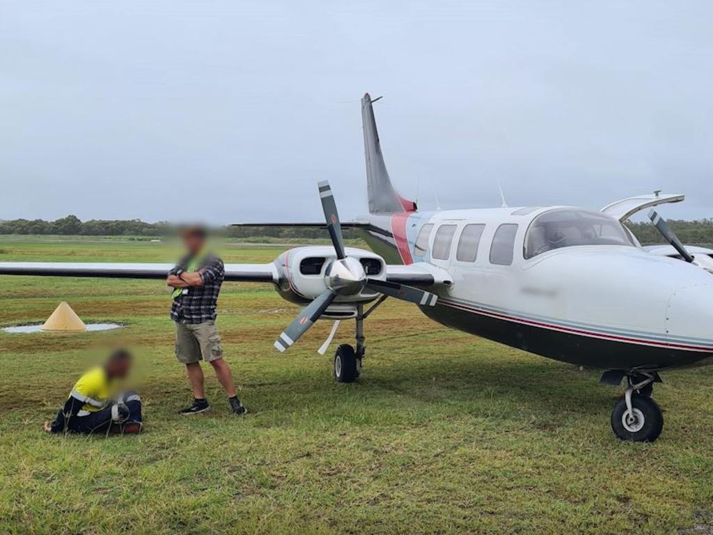 Cash and cannabis were allegedly found hidden in a light plane that arrived at Redcliffe Airport, north of Brisbane, from Melbourne on Monday. Picture: Supplied / QPS