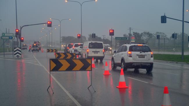 Wet weather in Townsville. Bohle River on the Bruce Highway. Workers prepare to close the lower bridge. Picture: Evan Morgan