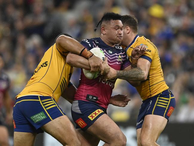 TOWNSVILLE, AUSTRALIA - JULY 22: Kulikefu Finefeuiaki of the Cowboys is tackled during the round 21 NRL match between North Queensland Cowboys and Parramatta Eels at Qld Country Bank Stadium on July 22, 2023 in Townsville, Australia. (Photo by Ian Hitchcock/Getty Images)