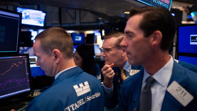 Traders work on the floor of the New York Stock Exchange. Picture: AFP