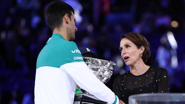 Tennis Australia chair Jayne Hrdlicka presents Novak Djokovic his trophy at the 2021 Australian Open at Melbourne Park. Picture: Cameron Spencer/Getty Images.