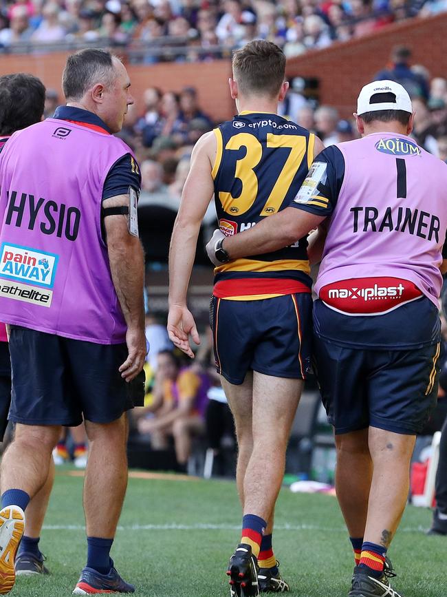 Being helped from the field. (Photo by Sarah Reed/AFL Photos via Getty Images)