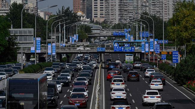 Chinese commuters grind through heavy traffic. Slowing growth in China is dampening the value of Australian resource exports according to the latest report from the Department of Industry’s Office of the Chief Economist. Picture: Jade GAO / AFP