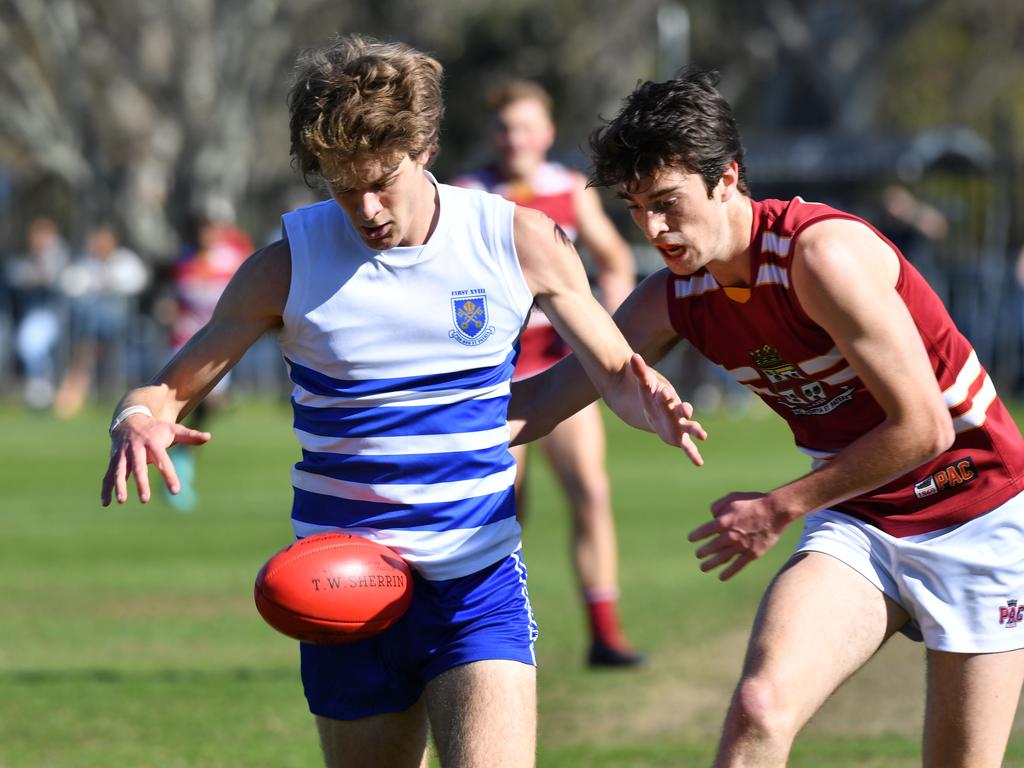 St Peter’s player Charlie Gibson and PAC’s Tom Sumner battle for the ball on Saturday. Picture: AAP/ Keryn Stevens.