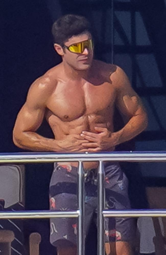 Zac Efron is ripped in tightest pants ever as he covers his