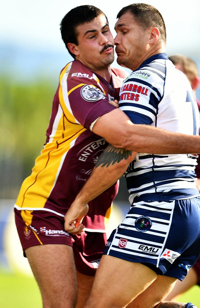 Joshua Abbott tackles Chippie Korostchuk of Charters Towers. Picture: Alix Sweeney