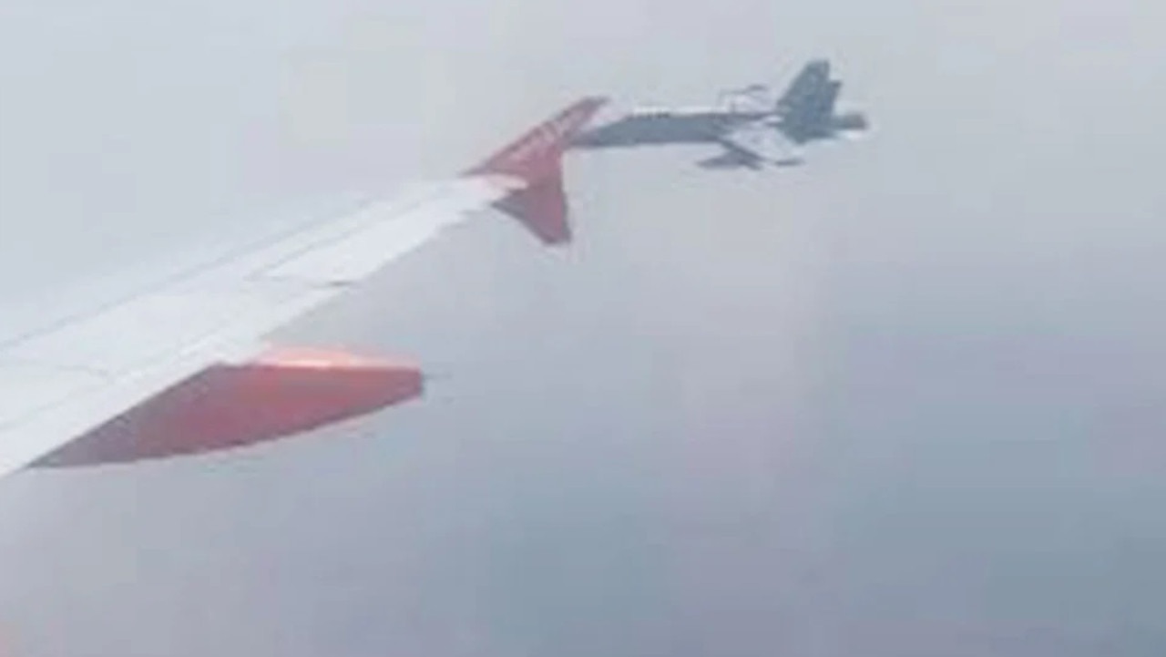 The F18 was spotted flying alongside the easyJet plane. Picture: Abigail Leslie/Robin Powell