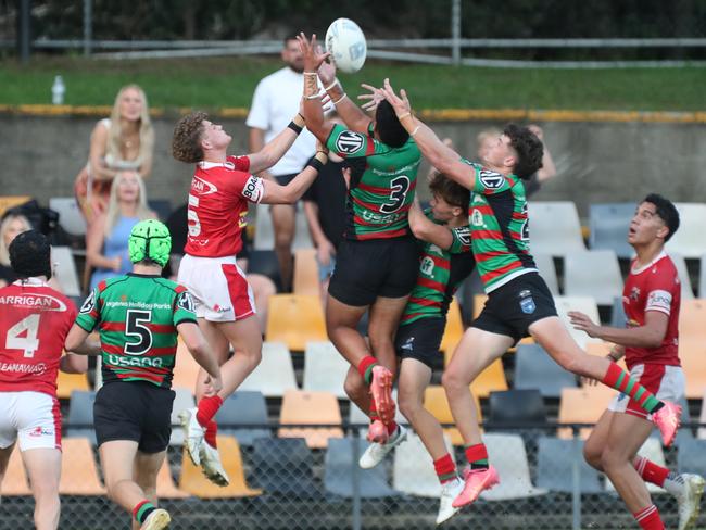 ClaytonMcGoon (No.3) flies high during the winning play for South Sydney. Picture Warren Gannon Photography