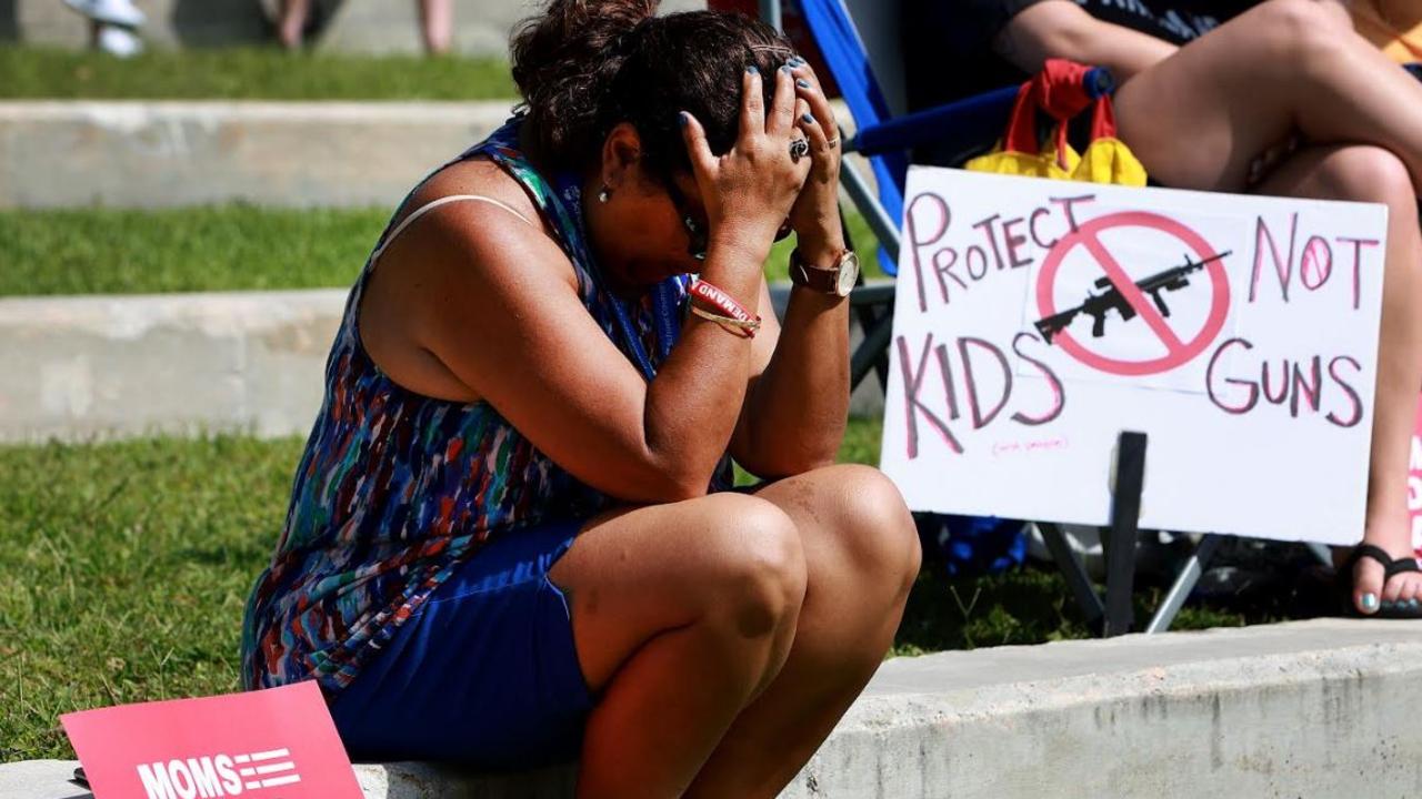 Tirza Clarke listens as the names of victims of recent mass shootings are read aloud during a vigil at the Sunrise Amphitheater on May 28, 2022 in Sunrise, Florida. Picture: Joe Raedle/Getty Image