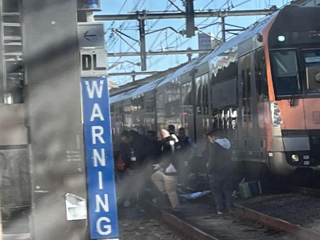 Police and paramedics were seen on the tracks during the incident. Photo: Twitter