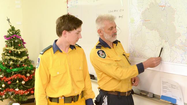 Father and son go over the RFS plan for the area. Picture: Jeremy Piper