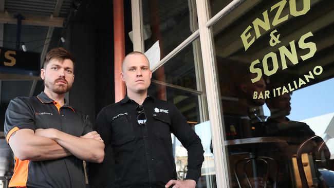 Lighting designer Dean Brosnan and electrician Lyle Rodgers outside of Enzo's and Sons in Caxton Street. Pic Peter Wallis