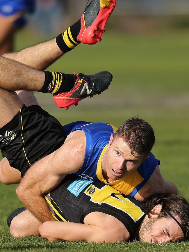 Ben Jolley wraps up a Richmond opponent this season. Picture Yuri Kouzmin