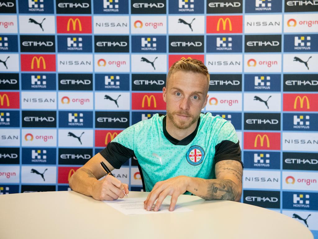 Jimmy Jeggo signs his Melbourne City contract. Picture: Supplied