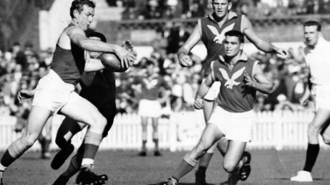 Fred Bills gets his kick away against Norwood in 1962. Picture: Pat Crowe