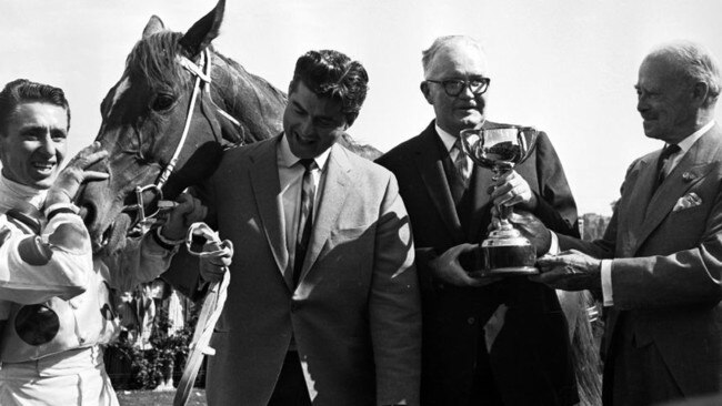 Bart Cummings and Roy Higgins with Light Fingers after a Melbourne Cup win in 1965.