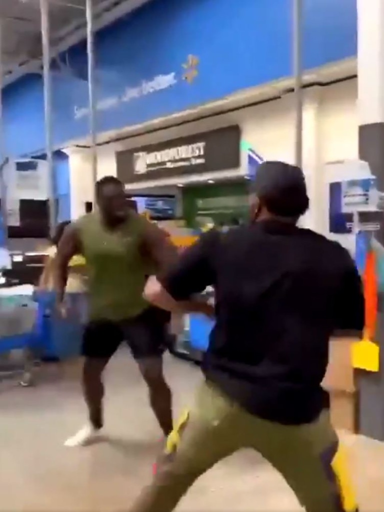 A man emerged from behind the counter ready to throw down.