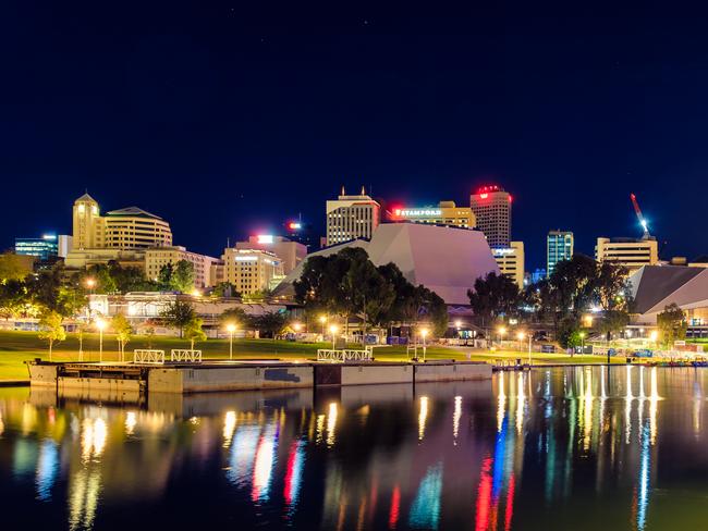 Adelaide: Adelaide city skyline at dusk viewed across Torrens river from King William bridge