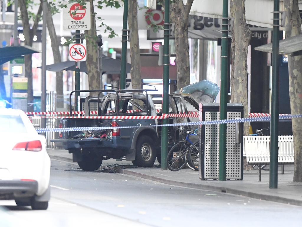 The burnt out vehicle seen on Bourke Street after the attack. Picture: James Ross
