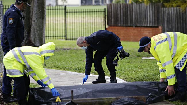 Police on the scene of the stabbing after a rugby league match on Saturday, which resulted in three people being taken to hospital. Picture: Adam Yip