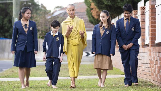 Buddhist monk Bhante Jason Chan with Pal Buddhist school students Alicia May, 16, Kimsear Park, 10, Stella Pearce, 13, and Anael Kumar, 13. Picture: Matthew Vasilescu