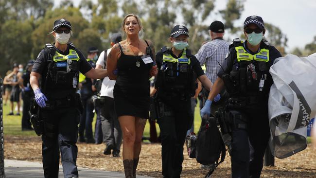 A woman is arrested at Elsternwick park in Melbourne. Picture: NCA NewsWire / Daniel Pockett