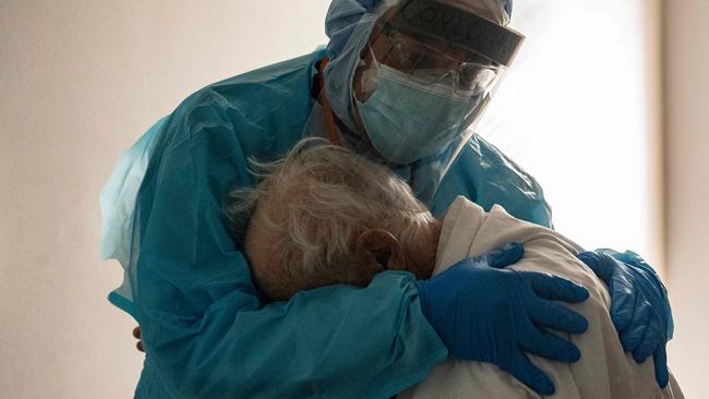 Doctor Joseph Varon comforts a patient in the COVID-19 intensive-care unit at the United Memorial Medical Centre in Houston, Texas. Picture: AFP